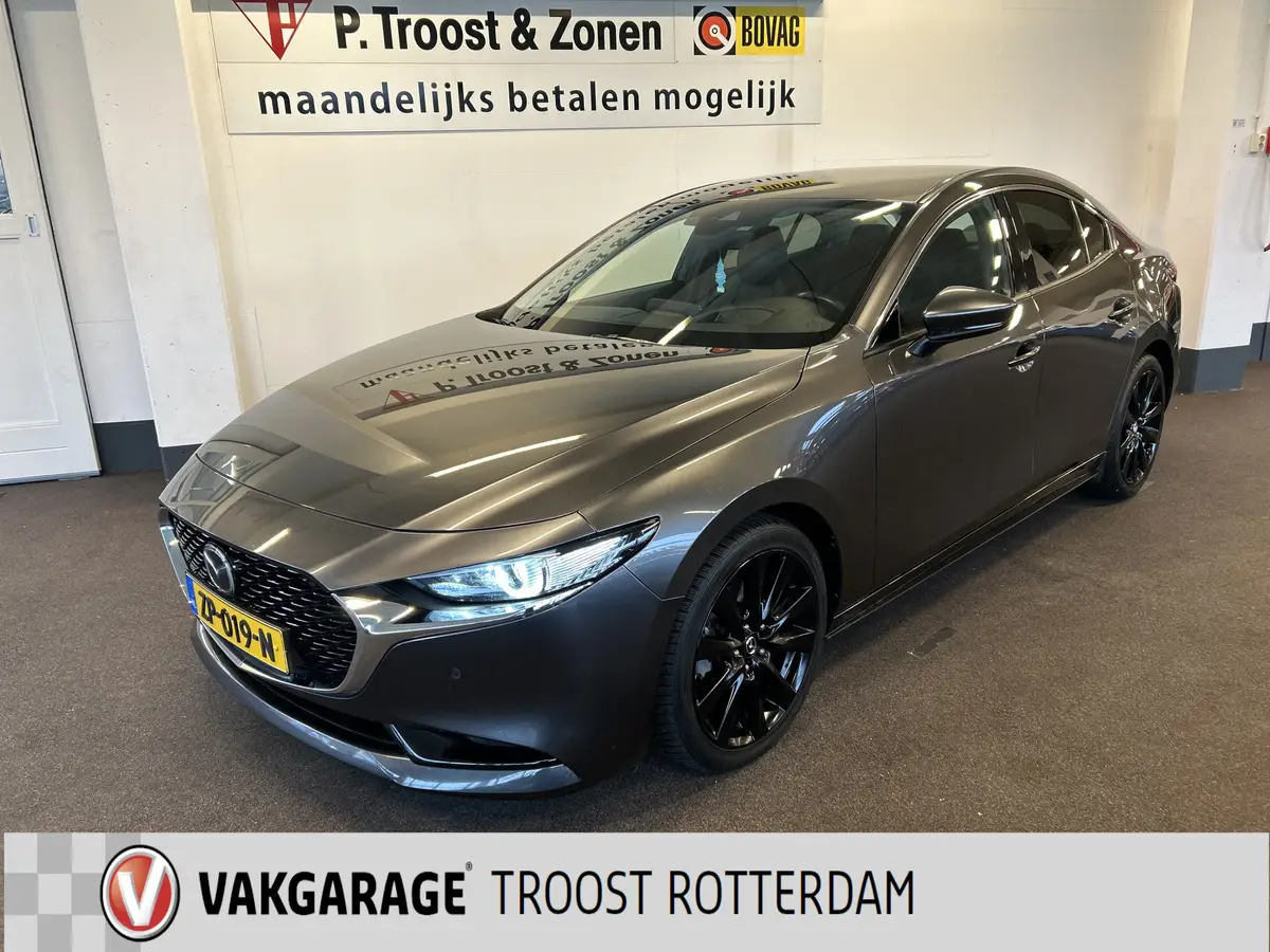 Mazda 3 2.0 e-SkyActiv-G M Hybrid 122 Luxury | Adaptieve cruise control | Stoel+Stuurverwarming | Head up display | Keyless | Achteruitrijcamera | Bose audio | Lederen bekleding | Navigatie | Climate control | Memory seats: foto 1