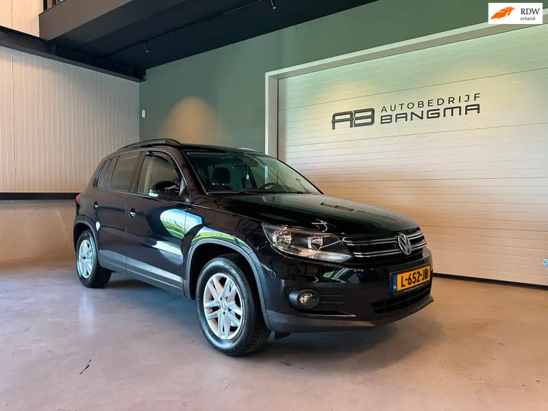 Volkswagen Tiguan 1.4 TSI SPORT&STYLE-uitv|CLIMA AIRCO|CRUISE CONTROL|LM-VELG|STOELVERWARMING|TREKHAAK|APK+OH-BEURT BIJ AFLEVERING 2013 leasen bij DreamLease: foto 1