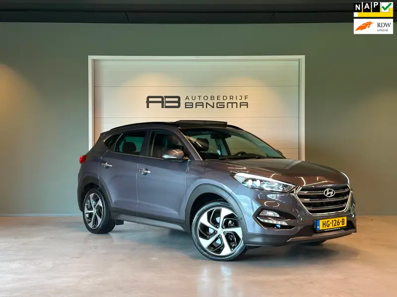 Hyundai Tucson 1.6 T-GDi 4WD AUTOMAAT PREMIUM|CLIMA AIRCO|PANORAMADAK|CRUISECONTROL|LEDEREN BEKLEDING|TREKHAAK|XENON|NAVIGATIE|NAP 2015 leasen bij DreamLease: foto 1