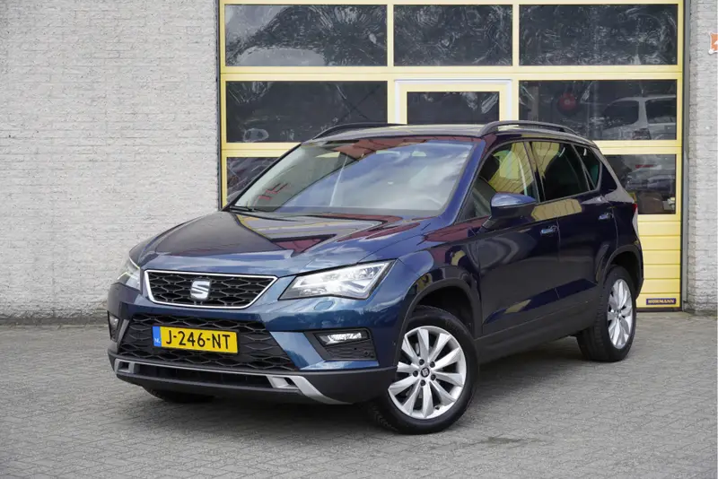 SEAT Ateca 1.5 TSI 150PK! Style Business Intense BJ2020 Lmv 17" | Led V+A | Pdc | Navi | Panoramadak | Trekhaak | Achteruitrijcamera | App-Connect | Climate control | Cruise control | Lederen bekleding | Verwarmde voorstoelen | Extra getint glas 2020 leasen bij DreamLease: foto 1
