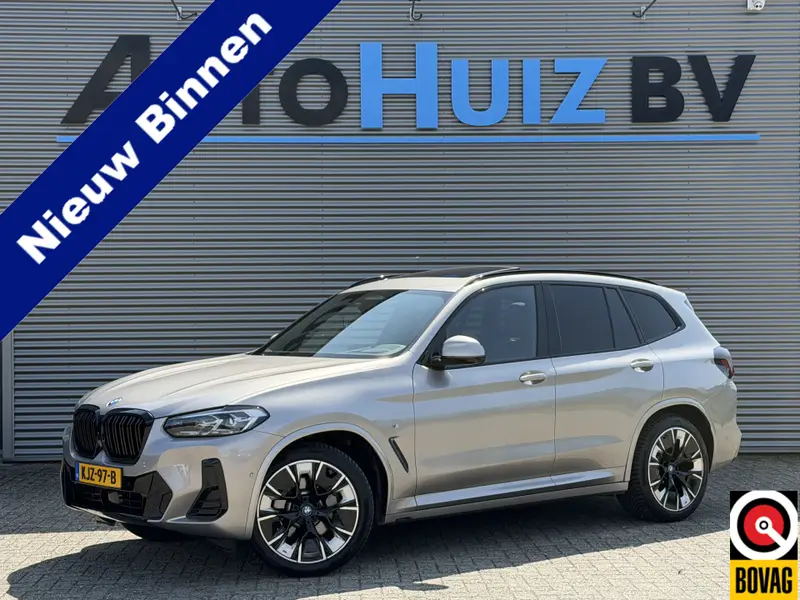 BMW iX3 High Executive 80 kWh SOH 100% M Sport Panoramadak Trekhaak Leder Harman-Kardon 20 inch 360 Camera Camera 2022 leasen bij DreamLease: foto 1